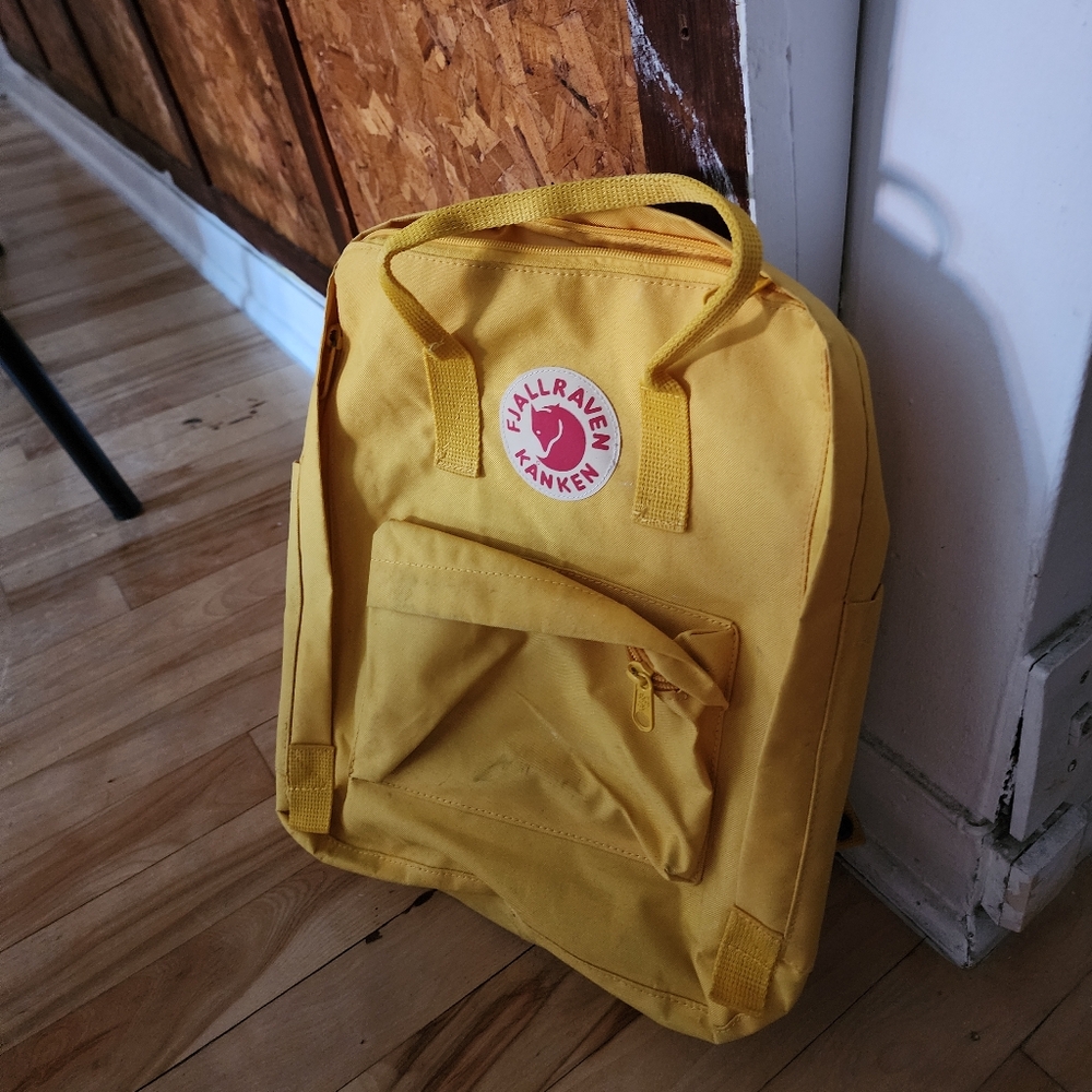 Yellow Fjallraven Kånken backpack